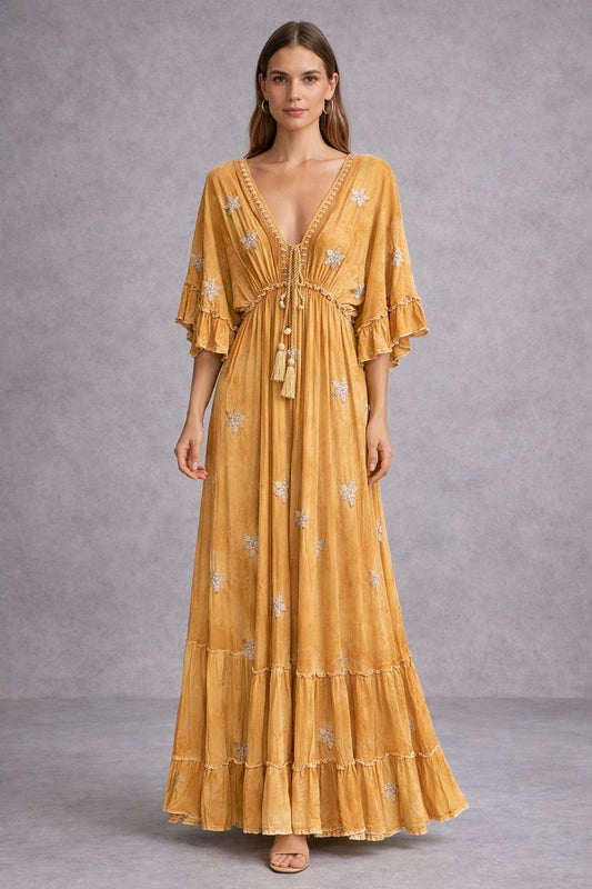 Maxi dress in a bohemian style with short sleeves and embellishments