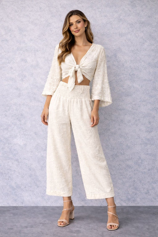 Pantsuit with a short jacket and long sleeves